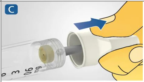 A close-up of a hand holding a tube

Description automatically generated